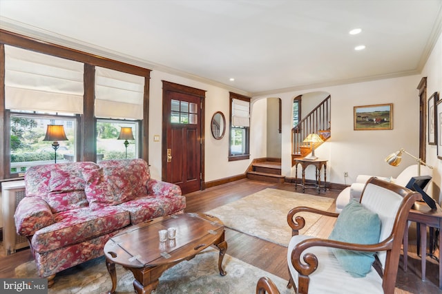 4009 Oglethorpe St, Hyattsville, MD 20782 - living area with crown molding, wood finished floors, stairs, arched walkways, and recessed lighting
