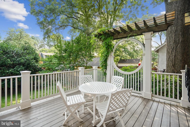 4009 Oglethorpe St, Hyattsville, MD 20782 - wooden terrace with outdoor dining area and a pergola