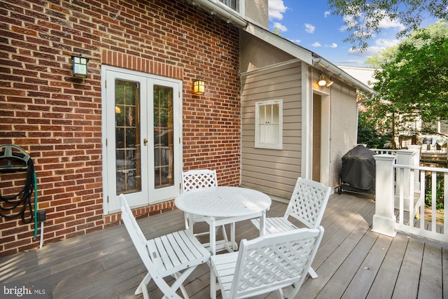 4009 Oglethorpe St, Hyattsville, MD 20782 - wooden deck with french doors, a grill, and outdoor dining area