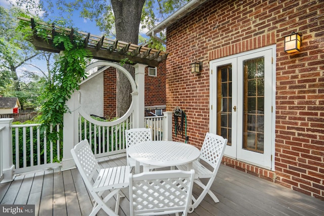 4009 Oglethorpe St, Hyattsville, MD 20782 - wooden deck featuring french doors and outdoor dining space