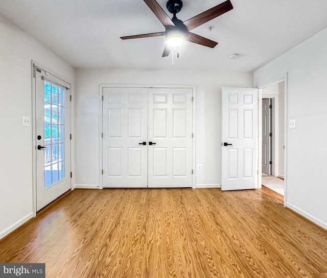 215 Westlake Blvd, Prince Frederick, MD 20678 - unfurnished bedroom featuring light wood finished floors, access to outside, a ceiling fan, and a closet