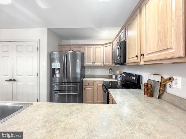 215 Westlake Blvd, Prince Frederick, MD 20678 - kitchen with stainless steel fridge, electric range, light countertops, light brown cabinets, and recessed lighting
