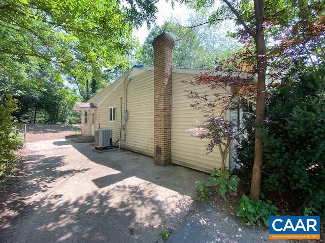 1430 Shenandoah Ave, Waynesboro, VA 22980 - view of property exterior with a chimney and a patio area
