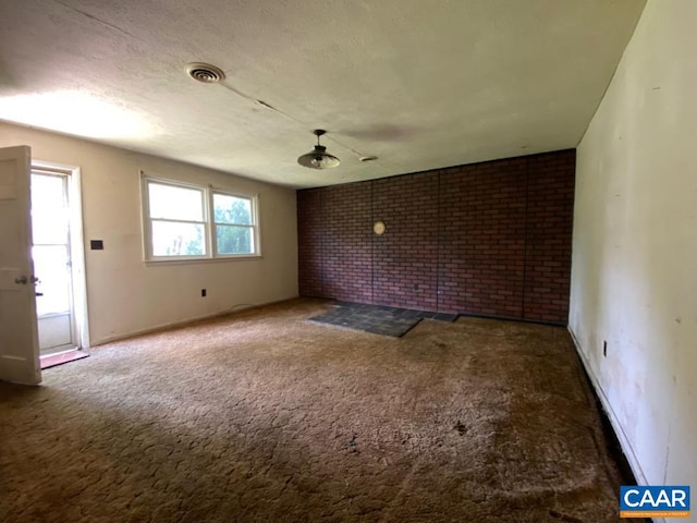 1430 Shenandoah Ave, Waynesboro, VA 22980 - unfurnished room with carpet floors and brick wall