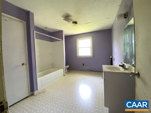 1430 Shenandoah Ave, Waynesboro, VA 22980 - bathroom with vanity, tile patterned floors, and  shower combination