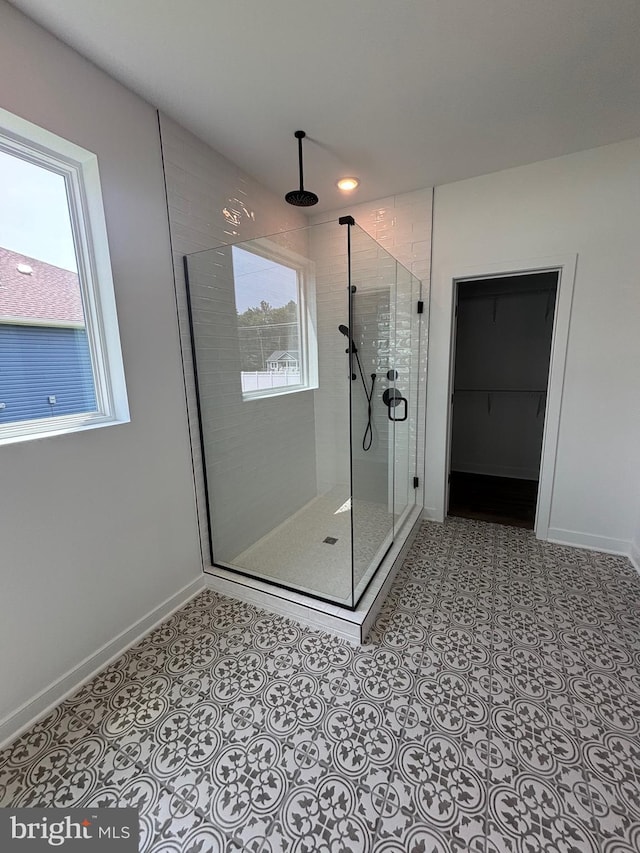 36821 W Old Gate Dr, Georgetown, DE 19947 - bathroom featuring a stall shower and baseboards
