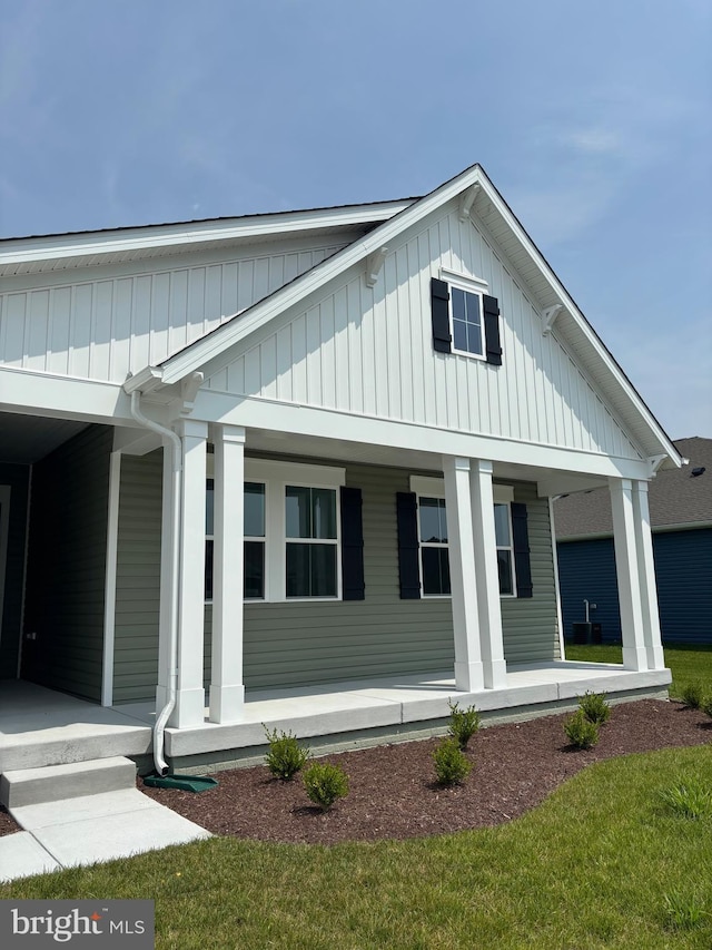 36821 W Old Gate Dr, Georgetown, DE 19947 - view of front of home featuring a porch and board and batten siding