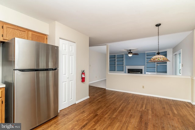 52 Jonquil Way, Sicklerville, NJ 08081 - kitchen featuring freestanding refrigerator, a ceiling fan, a fireplace, and wood finished floors