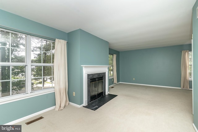 52 Jonquil Way, Sicklerville, NJ 08081 - unfurnished living room featuring carpet floors, a premium fireplace, and plenty of natural light