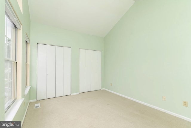 52 Jonquil Way, Sicklerville, NJ 08081 - unfurnished bedroom with multiple closets, light colored carpet, and vaulted ceiling