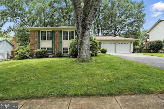8823 Newport Ct, Springfield, VA 22153 - view of front of home with a front yard, a garage, and brick siding
