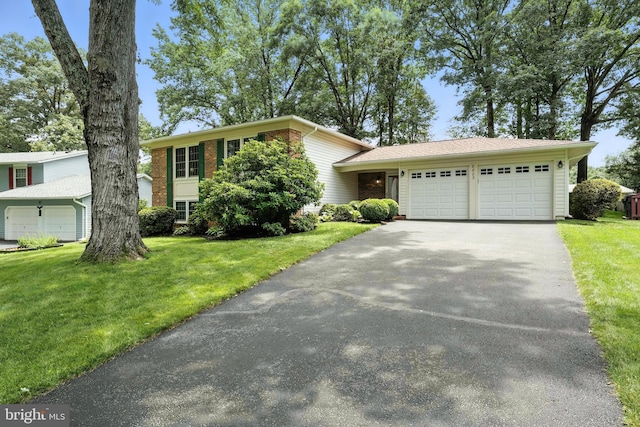 8823 Newport Ct, Springfield, VA 22153 - split level home featuring driveway, a garage, a front lawn, and brick siding