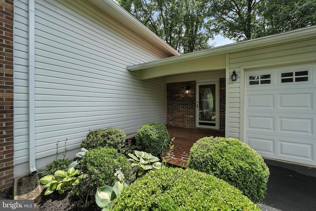 8823 Newport Ct, Springfield, VA 22153 - property entrance with brick siding and an attached garage