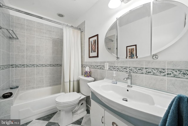 8823 Newport Ct, Springfield, VA 22153 - bathroom featuring vanity, shower / bath combo with shower curtain, and tile walls