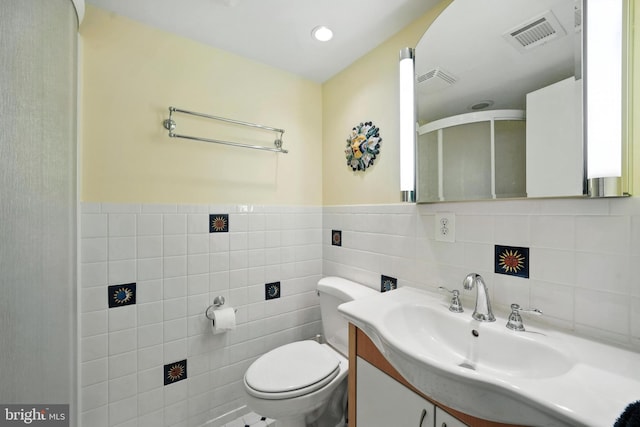 8823 Newport Ct, Springfield, VA 22153 - full bath with tile walls, vanity, a stall shower, and wainscoting