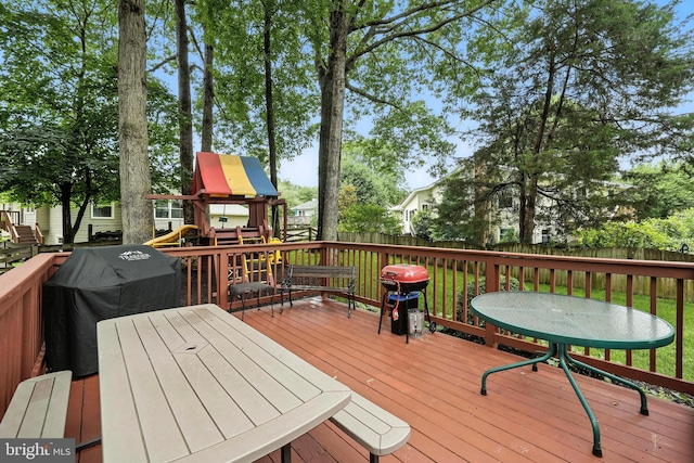 8823 Newport Ct, Springfield, VA 22153 - wooden deck featuring a playground, a fenced backyard, and area for grilling