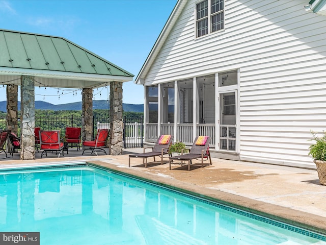 400 Deer Run Cir, Front Royal, VA 22630 - view of swimming pool with a mountain view, a sunroom, and a patio area