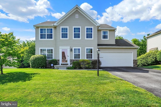 1765 Ivy Pump Ln, York, PA 17408 - view of front of property with driveway, a front lawn, a garage, and stone siding