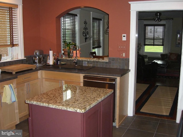 326 W Race, Pottstown, PA 19464 - kitchen with arched walkways, dishwasher, light stone counters, and plenty of natural light