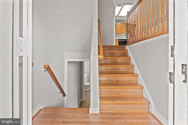 6104 9th St, Chesapeake Beach, MD 20732 - stairway with wood finished floors and baseboards