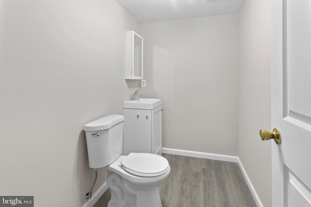 6104 9th St, Chesapeake Beach, MD 20732 - bathroom featuring wood finished floors and vanity