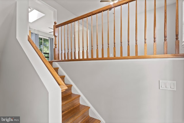 6104 9th St, Chesapeake Beach, MD 20732 - staircase featuring ceiling fan and a skylight