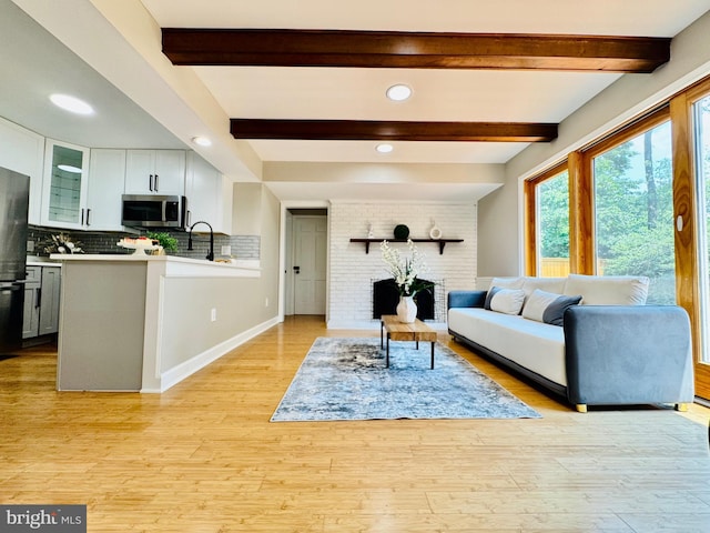 5933 Westridge Ct, Alexandria, VA 22310 - living room featuring beam ceiling, light wood-style floors, recessed lighting, and brick wall