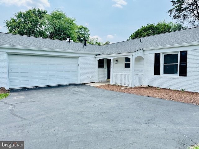 5933 Westridge Ct, Alexandria, VA 22310 - ranch-style home with brick siding, driveway, a garage, and a shingled roof