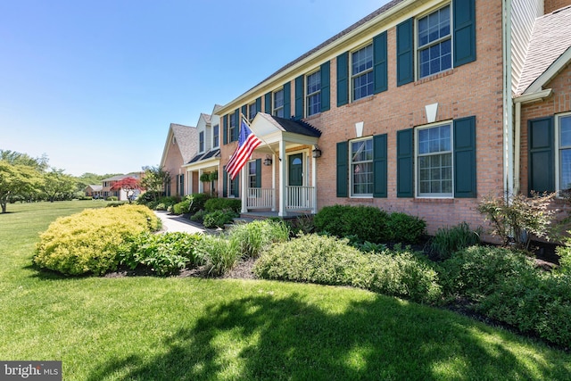 872 The Old Station Ct, Woodbine, MD 21797 - view of front facade featuring a front yard and brick siding