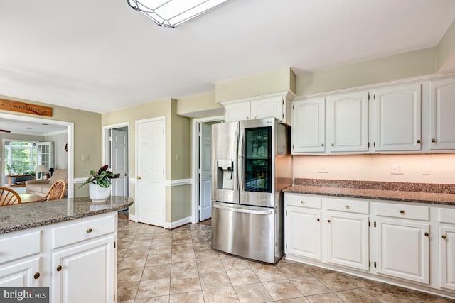 872 The Old Station Ct, Woodbine, MD 21797 - kitchen with stainless steel fridge, dark stone countertops, and white cabinets