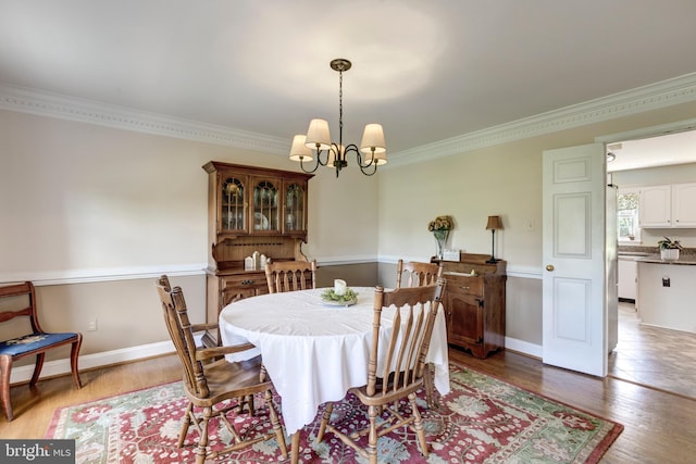 872 The Old Station Ct, Woodbine, MD 21797 - dining space featuring a chandelier, ornamental molding, and light wood-style flooring