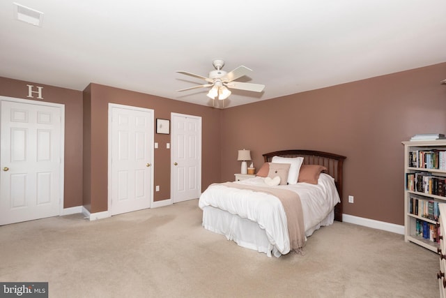 872 The Old Station Ct, Woodbine, MD 21797 - bedroom with carpet flooring, multiple closets, and a ceiling fan