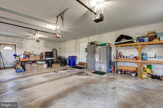 872 The Old Station Ct, Woodbine, MD 21797 - garage with a garage door opener and freestanding refrigerator