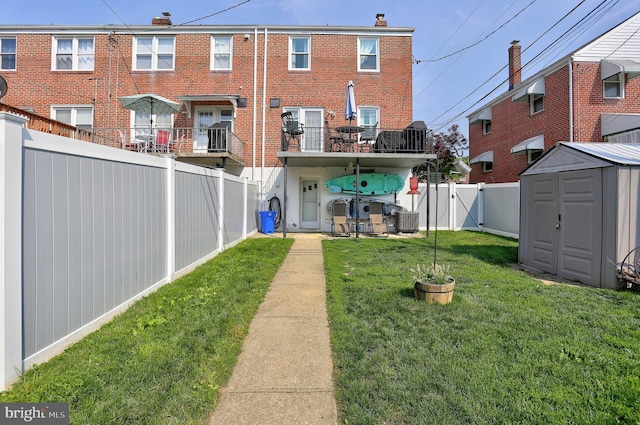 159 Garden Ridge Rd, Catonsville, MD 21228 - rear view of house with a storage unit, brick siding, a fenced backyard, and a chimney