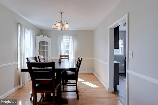 159 Garden Ridge Rd, Catonsville, MD 21228 - dining room featuring a chandelier and light wood finished floors