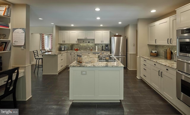 7028 Ely Rd, New Hope, PA 18938 - kitchen featuring stainless steel appliances, backsplash, a center island, white cabinetry, and recessed lighting