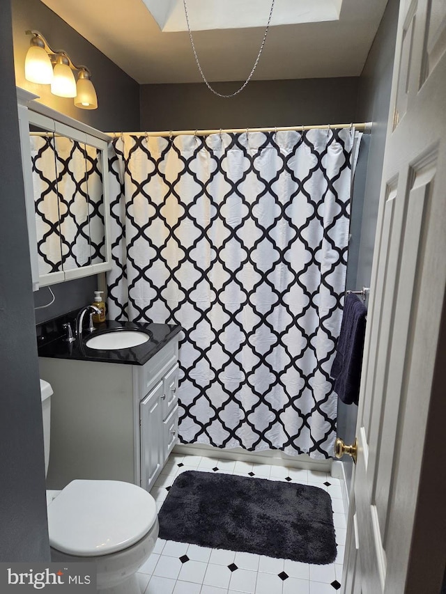 6132 Charles St, Philadelphia, PA 19135 - bathroom with vanity, tile patterned flooring, and a shower with curtain