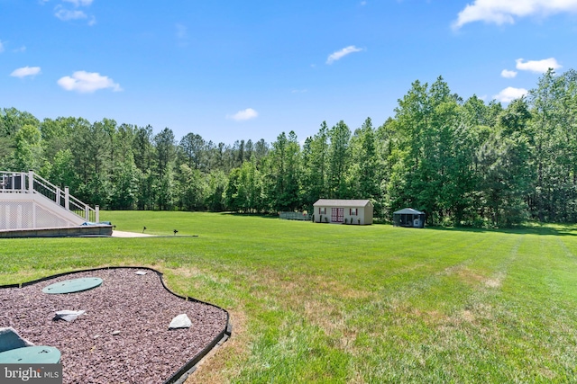 4479 Coachmans Path Ct, Waldorf, MD 20601 - view of grassy yard featuring a shed and a forest view