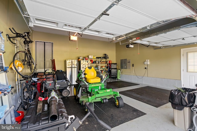 4479 Coachmans Path Ct, Waldorf, MD 20601 - garage with freestanding refrigerator, electric panel, and a garage door opener