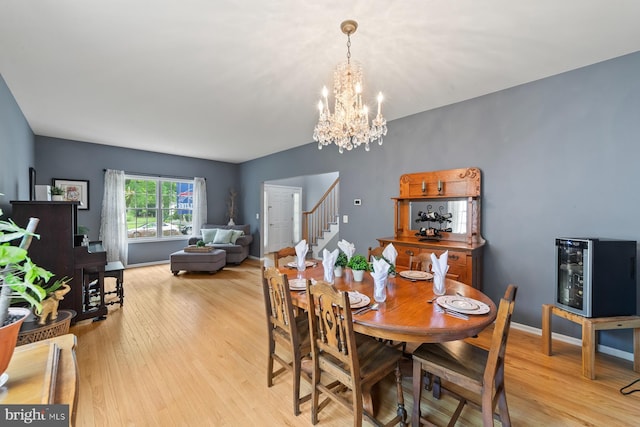 114 Ketterer Ct, Lawrence, NJ 08648 - dining area with stairs, a chandelier, and wood finished floors