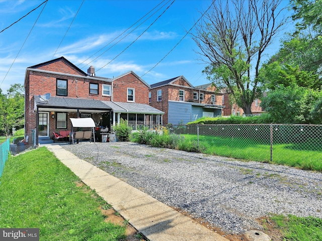 332 W Maple St, York, PA 17401 - view of front of home featuring brick siding and a chimney