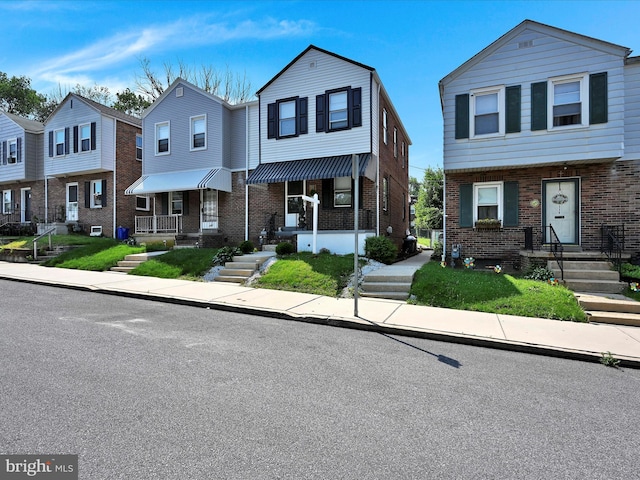 332 W Maple St, York, PA 17401 - townhome / multi-family property with brick siding and a residential view
