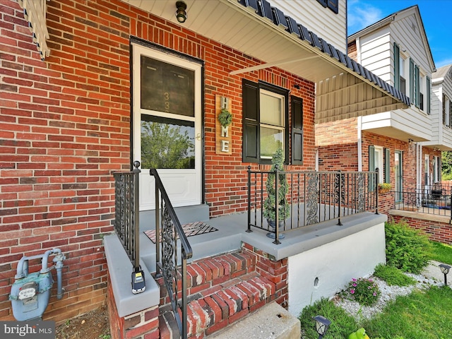 332 W Maple St, York, PA 17401 - property entrance featuring covered porch and brick siding