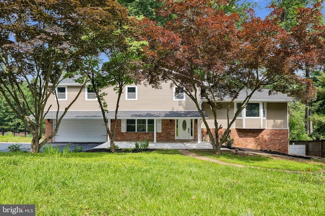 6612 Jacks Ct, Mount Airy, MD 21771 - view of front of house with brick siding, a garage, and driveway