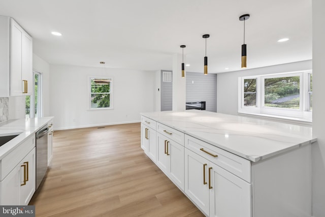 6612 Jacks Ct, Mount Airy, MD 21771 - kitchen with stainless steel dishwasher, white cabinets, light stone counters, light wood-style floors, and recessed lighting