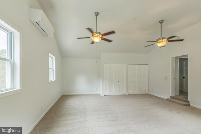 6612 Jacks Ct, Mount Airy, MD 21771 - unfurnished bedroom featuring vaulted ceiling, a wall unit AC, multiple closets, light colored carpet, and ceiling fan