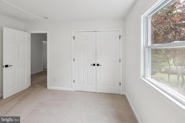 6612 Jacks Ct, Mount Airy, MD 21771 - unfurnished bedroom with light colored carpet, multiple windows, and a closet