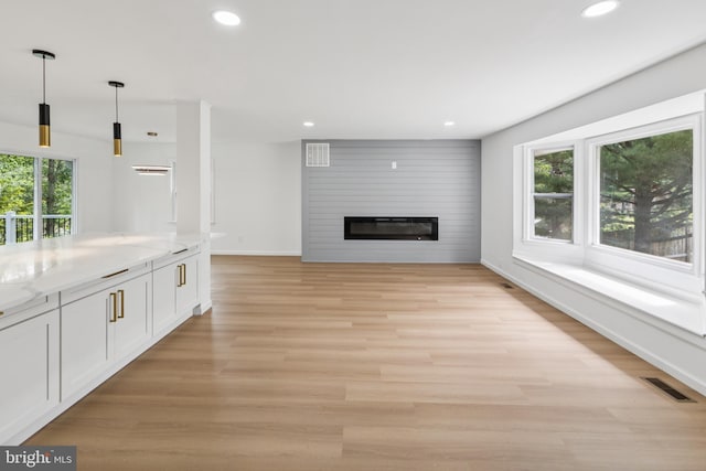 6612 Jacks Ct, Mount Airy, MD 21771 - unfurnished living room featuring recessed lighting, a fireplace, and light wood-style flooring