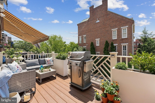 1206 N Pitt St, Alexandria, VA 22314 - wooden terrace with area for grilling and an outdoor living space