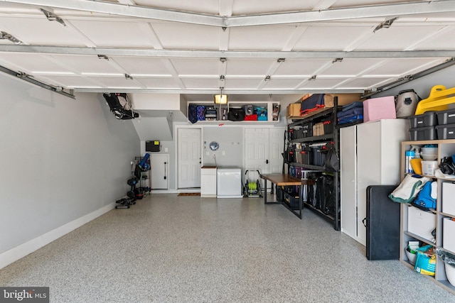 1206 N Pitt St, Alexandria, VA 22314 - garage with washer and clothes dryer and baseboards